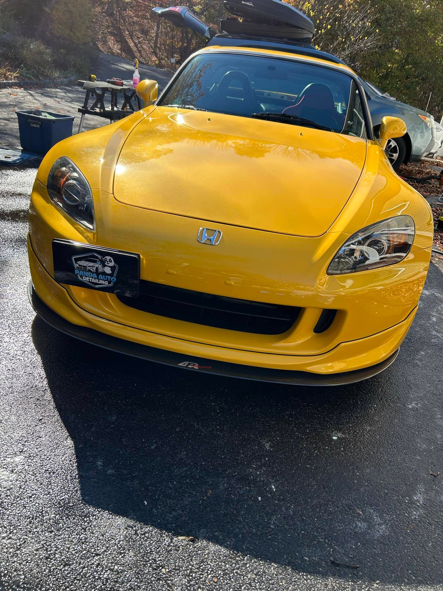 Yellow Honda S2000 after paint correction, mirror-like hood finish